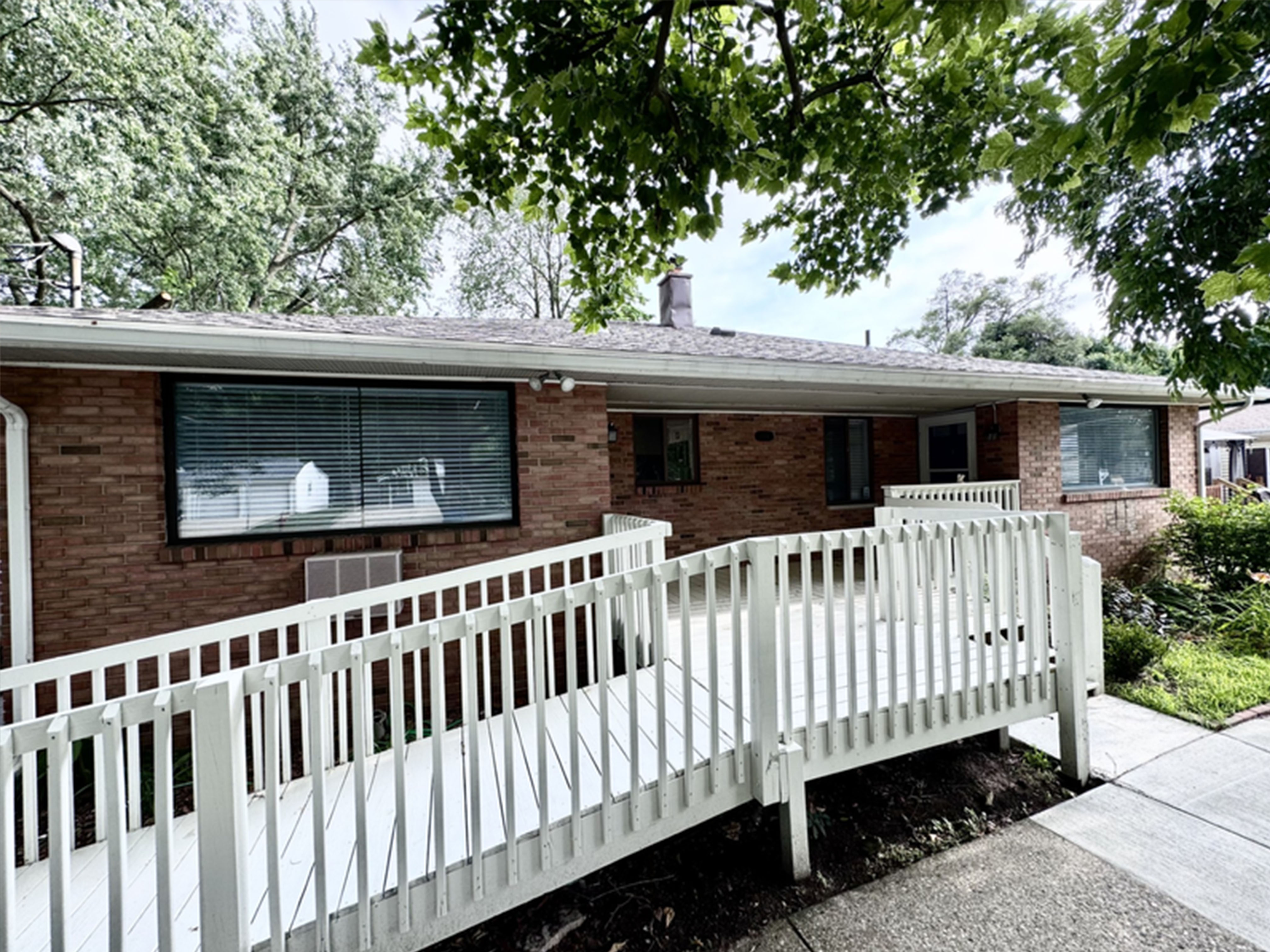 Accessible entrance with wheelchair ramp and welcoming exterior