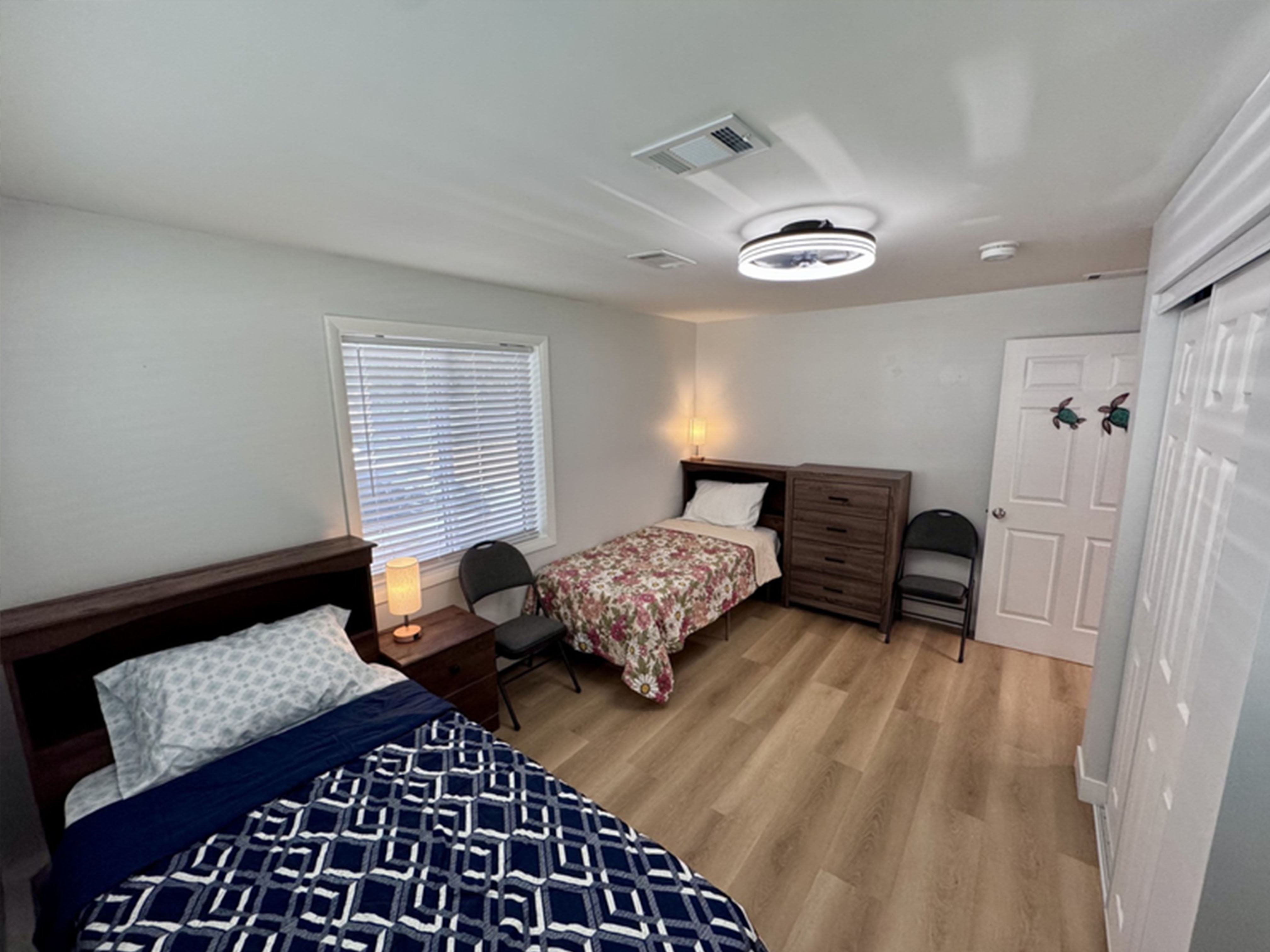 Comfortable private bedroom with modern furnishings and natural light