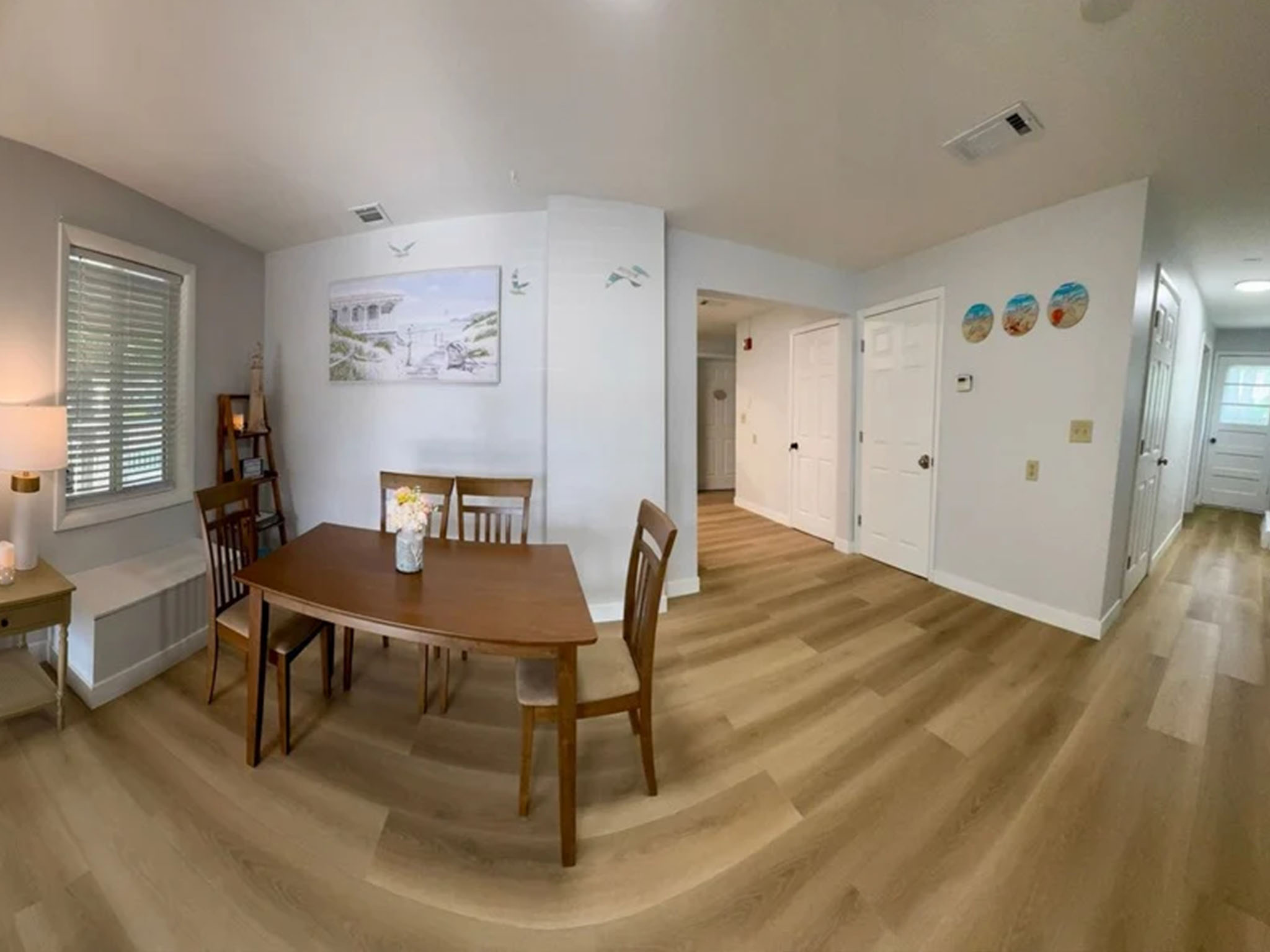 Bright dining area with natural light and wooden table