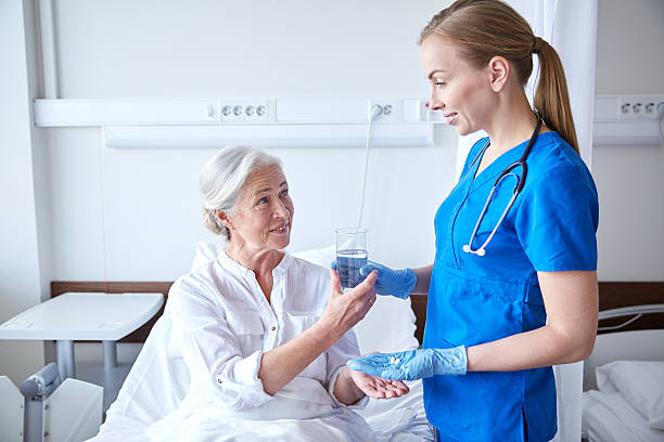 Professional caregiver assisting with medication management