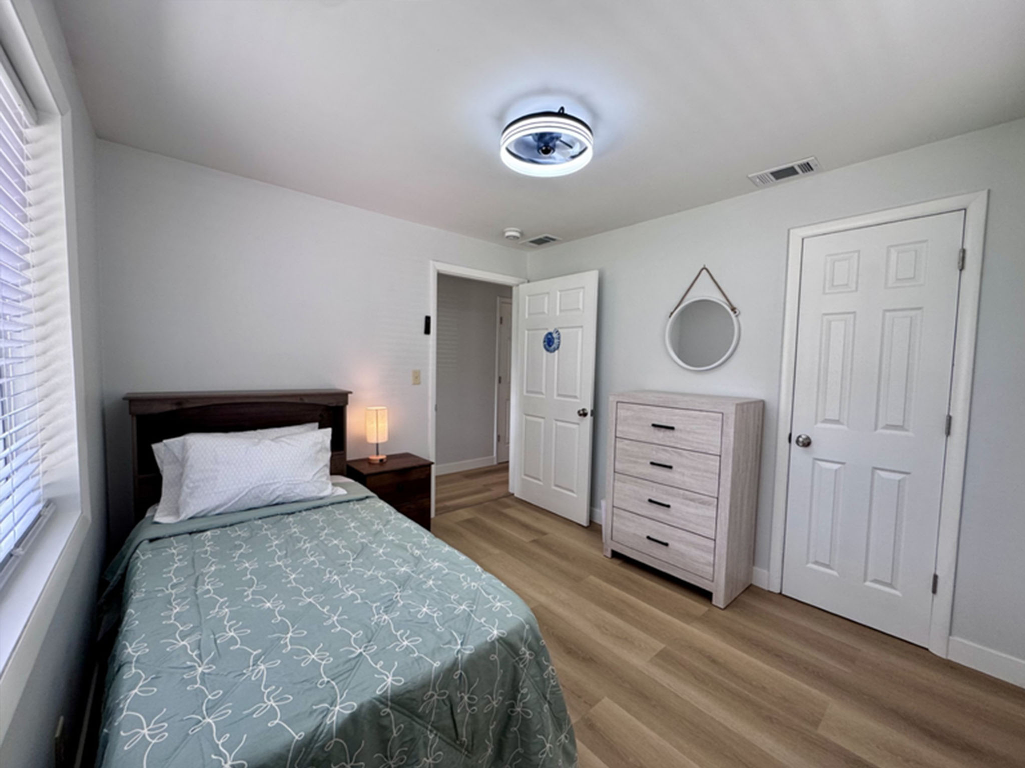 Peaceful private bedroom with comfortable furnishings and personal touches